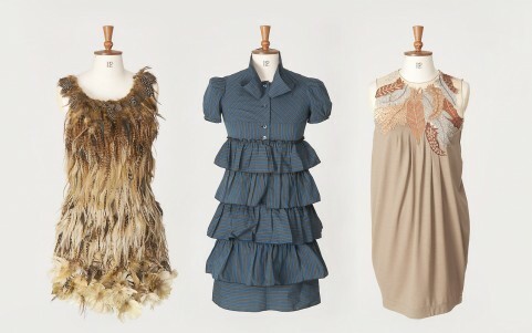 Three vintage dresses on traditional mannequins
