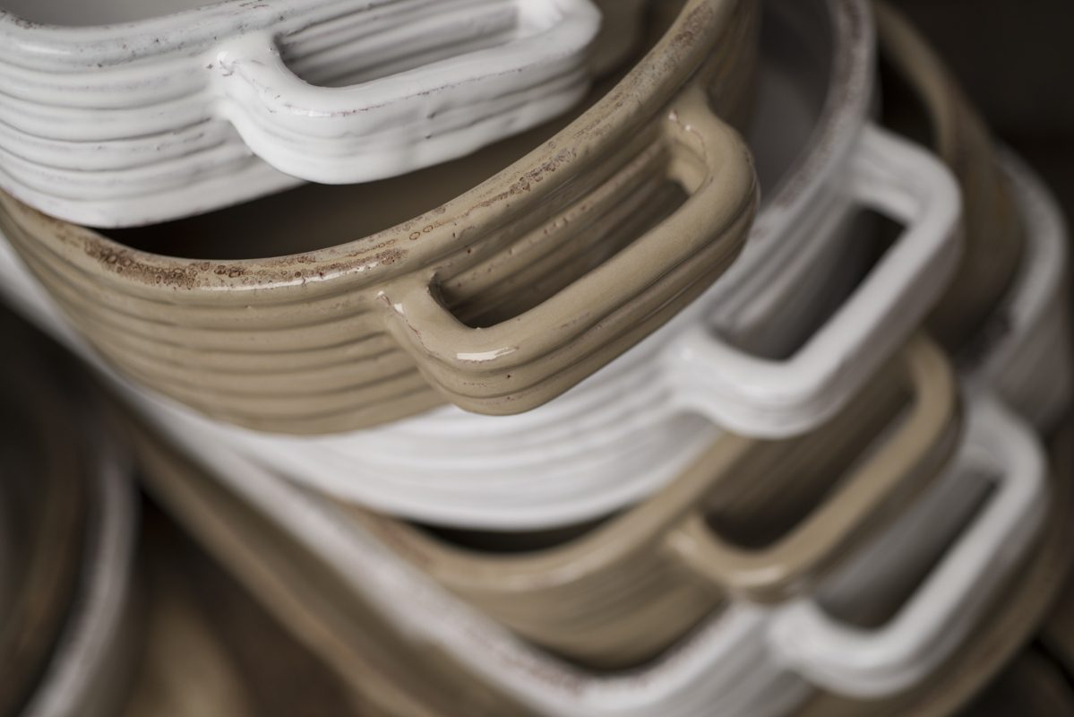 Close Up of Stack of White and Tan-colored Baking Dishes
