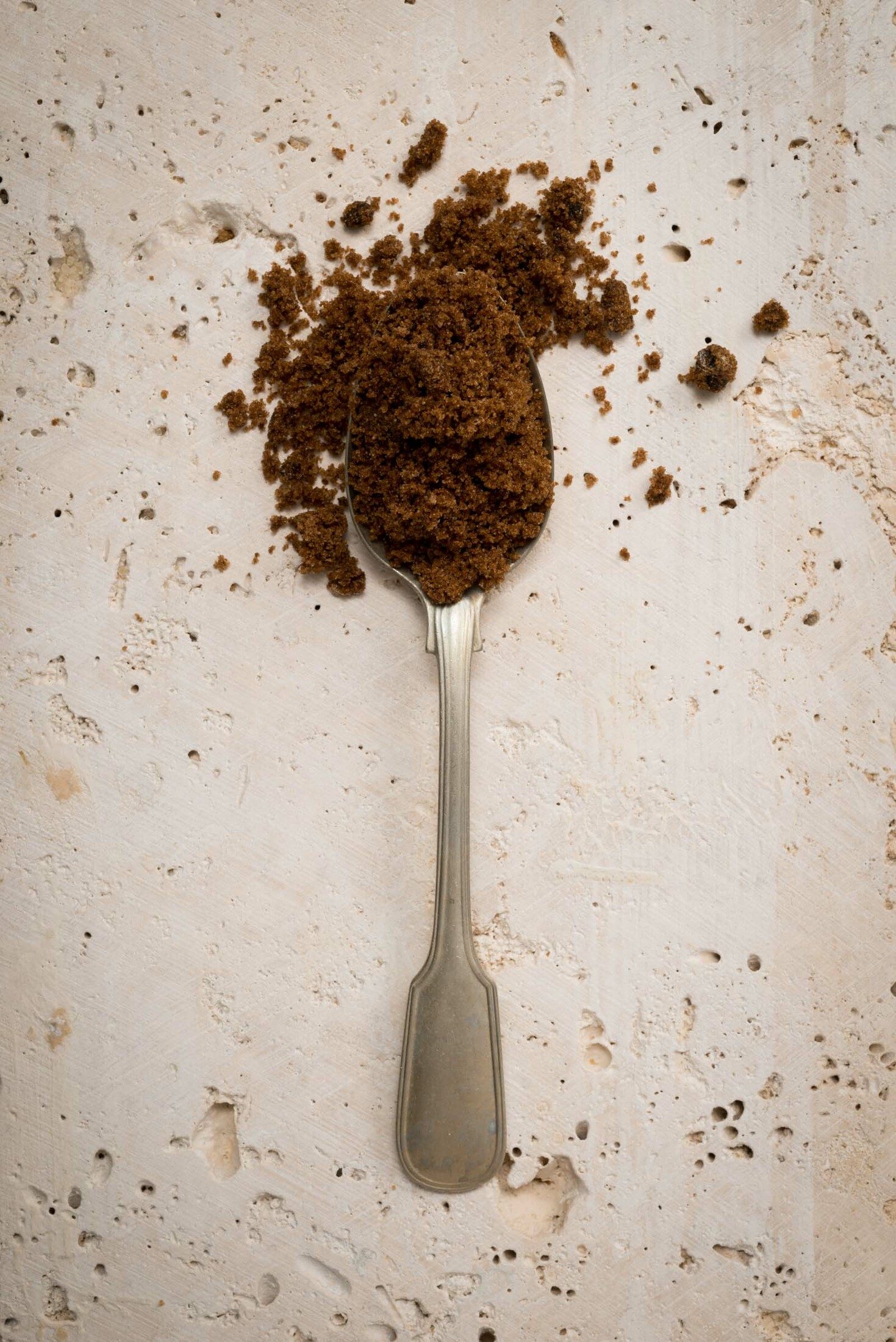Teaspoon filled with dark brown sugar