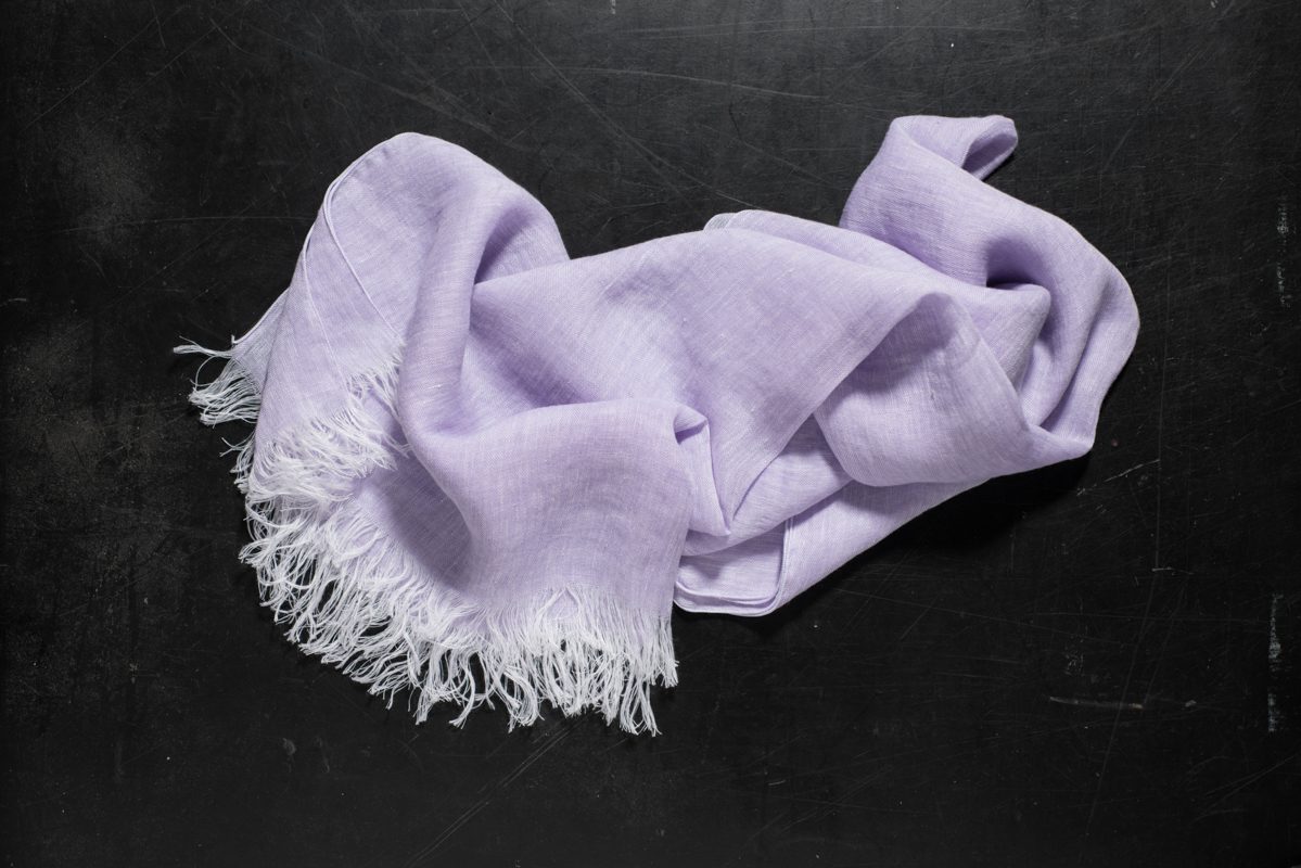Lavender Hand Towel with White Fringes on Dark Surface